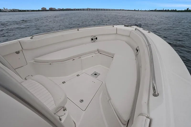 Slide: The Image of 2013 Robalo R260 Center Console boat on calm water. - 2