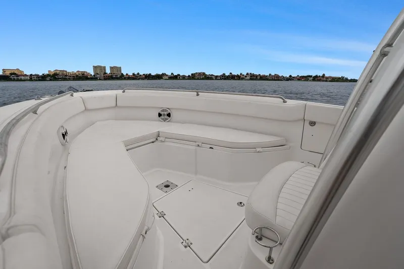 Slide: The Image of 2013 Robalo R260 Center Console boat on calm water. - 22