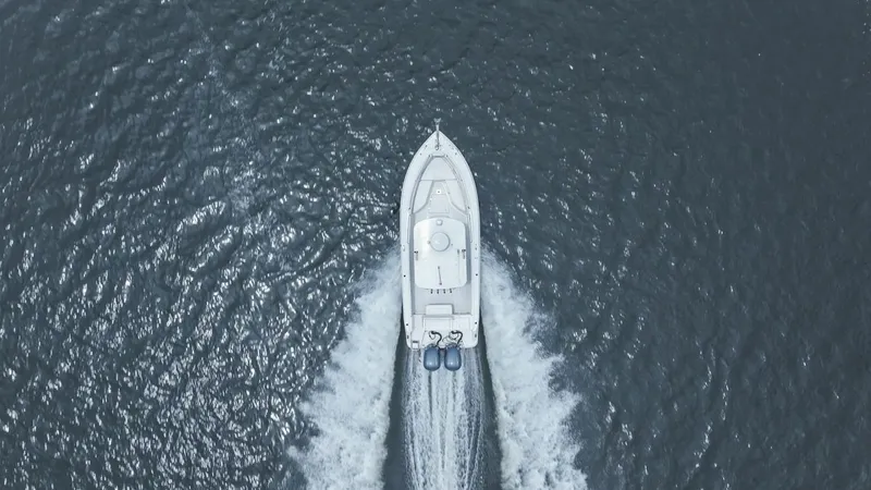 Slide: The Image of Aerial view of 2013 Robalo R260 Center Console boat on water. - 31