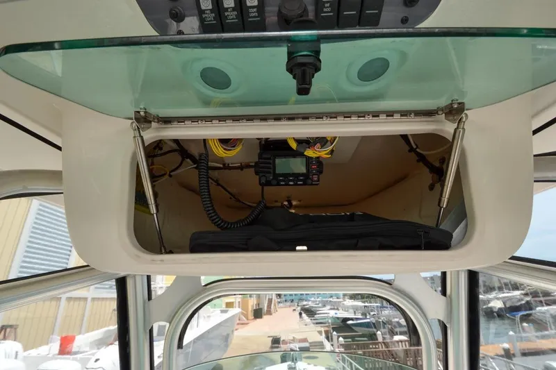 Slide: The Image of Interior view of 2013 Robalo R260 Center Console with electronics compartment. - 32