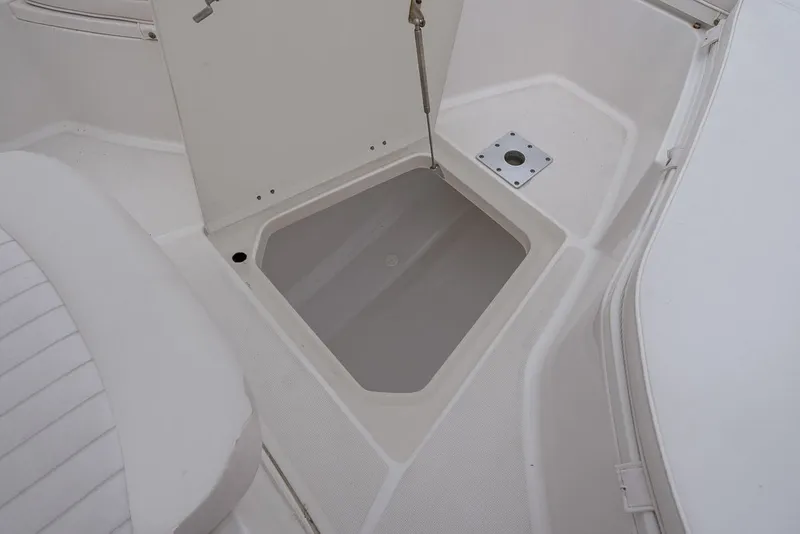 Slide: The Image of Robalo R260 Center Console 2013 storage compartment open. - 33
