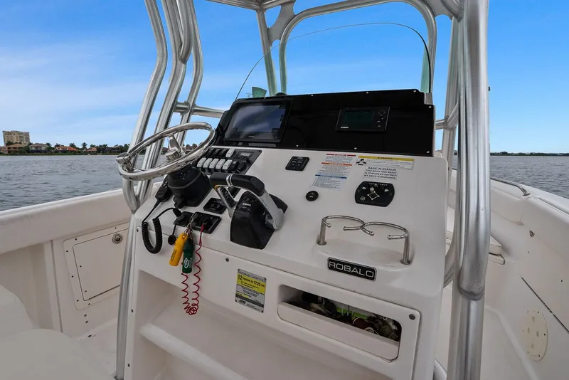 Slide: The Image of Robalo R260 Center Console 2013 helm on open water. - 34