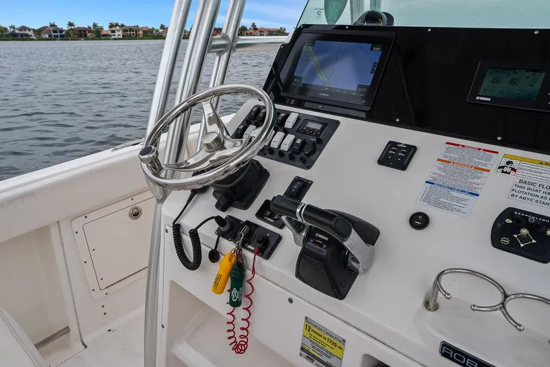 Slide: The Image of Helm console of a 2013 Robalo R260 Center Console boat. - 4