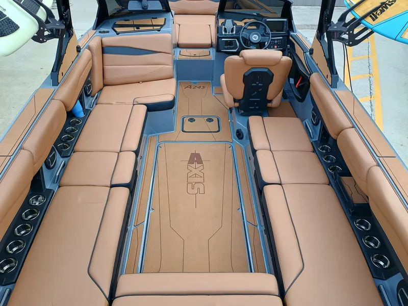 Slide: The Image of Interior of Axis A245 boat, 2024 model, featuring brown leather seating. - 4