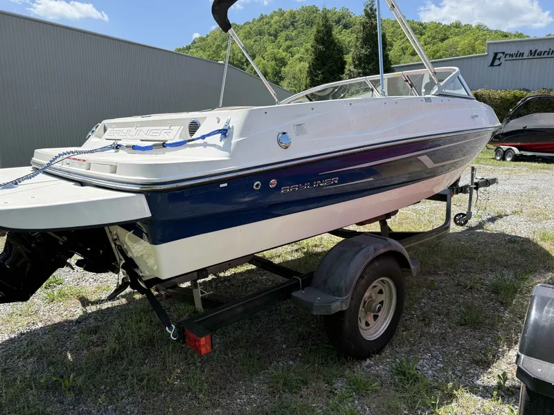 Slide: The Image of 2015 Bayliner 185 Bowrider on trailer, parked outdoors. - 4