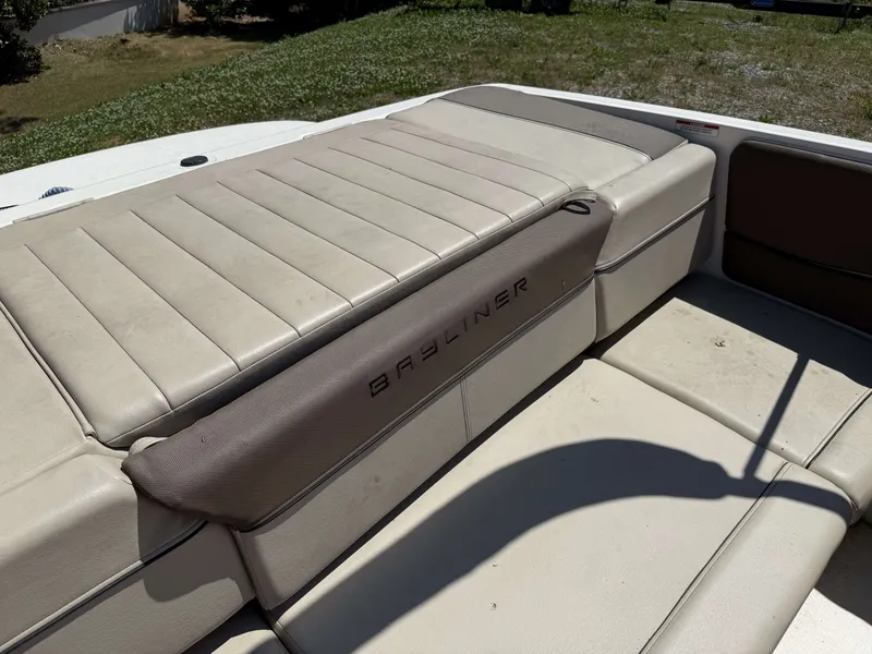 Slide: The Image of Bayliner 185 Bowrider 2015 seating area with beige upholstery. - 9