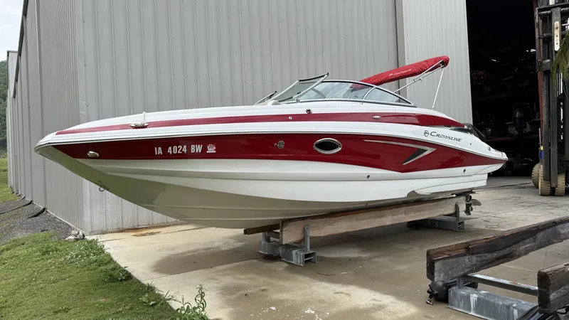 The Image of 2022 Crownline Eclipse E255 XS boat in red and white. - 1