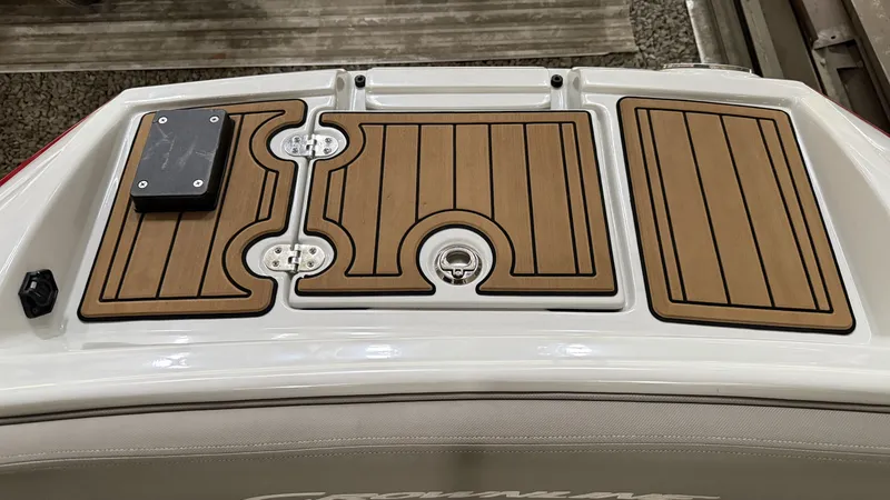 Slide: The Image of Crownline Eclipse E255 XS 2022 boat rear with wood finish. - 11