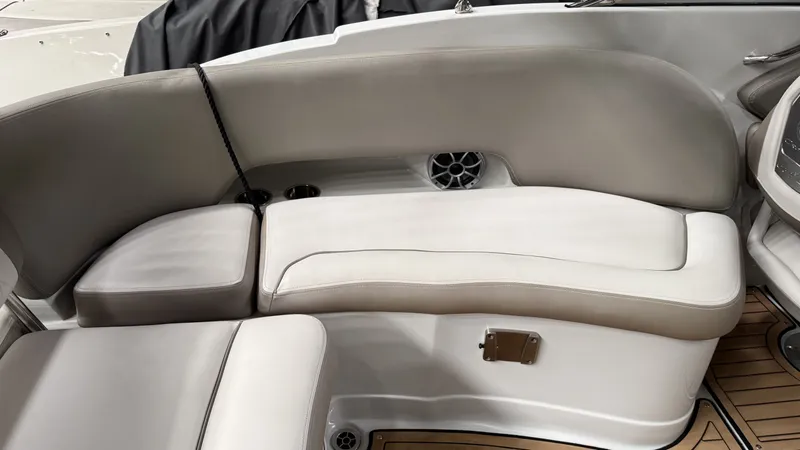 Slide: The Image of Interior of 2022 Crownline Eclipse E255 XS with beige seating. - 2