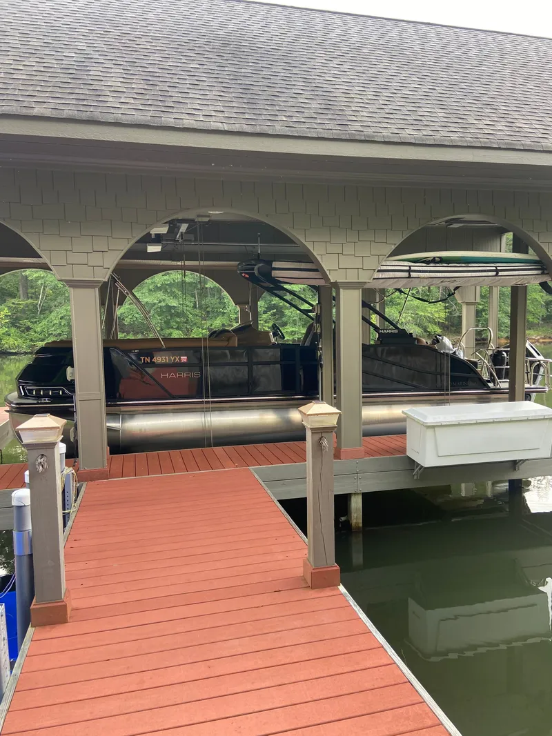 The Image of 2023 Harris Grand Mariner 250 boat in covered dock. - 1