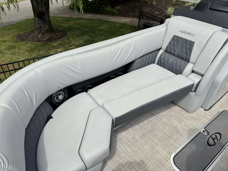 Slide: The Image of 2020 Harris Solstice 250 SLDH boat with luxurious cushioned seating area. - 7