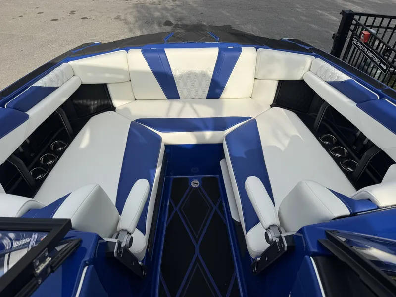 Slide: The Image of Interior of 2025 Malibu M242 boat with blue and white upholstery. - 3
