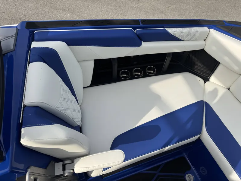 Slide: The Image of Interior of 2025 Malibu M242 with blue and white seating. - 4
