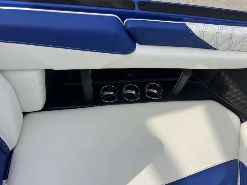 Slide: The Image of Interior of 2025 Malibu M242 with blue and white seating. - 5