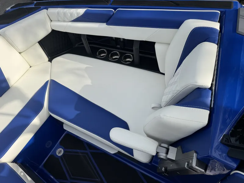 Slide: The Image of Interior of 2025 Malibu M242 with blue and white seating. - 6
