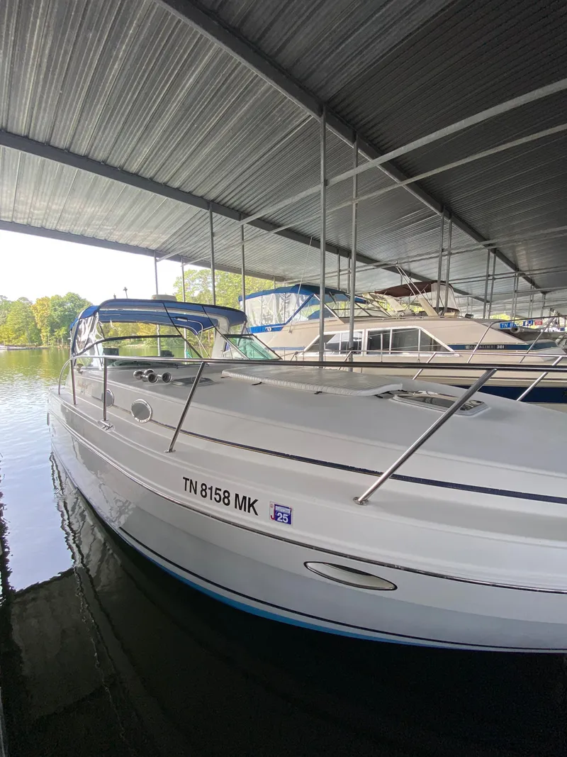 The Image of 2000 Rinker Fiesta Vee 340 boat docked in marina. - 1