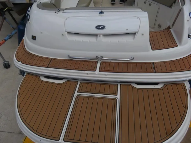 Slide: The Image of Rear view of 2006 Sea Ray 240 Sundeck with wooden deck. - 4