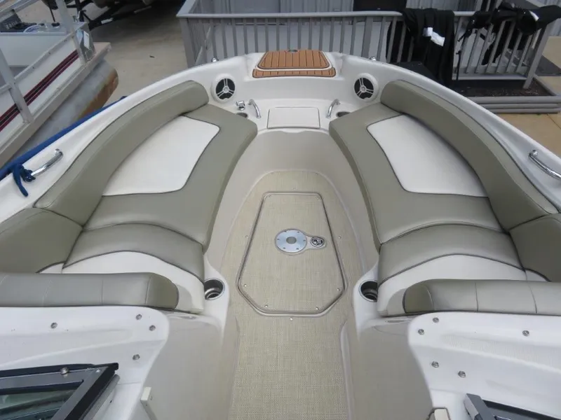 Slide: The Image of Interior of a 2006 Sea Ray 240 Sundeck with beige seating. - 6