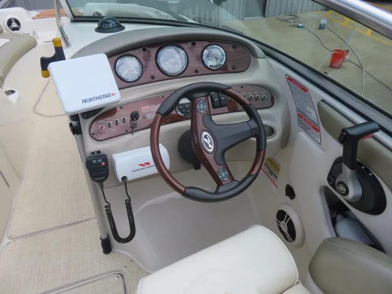 Slide: The Image of Dashboard of a 2006 Sea Ray 240 Sundeck boat. - 8