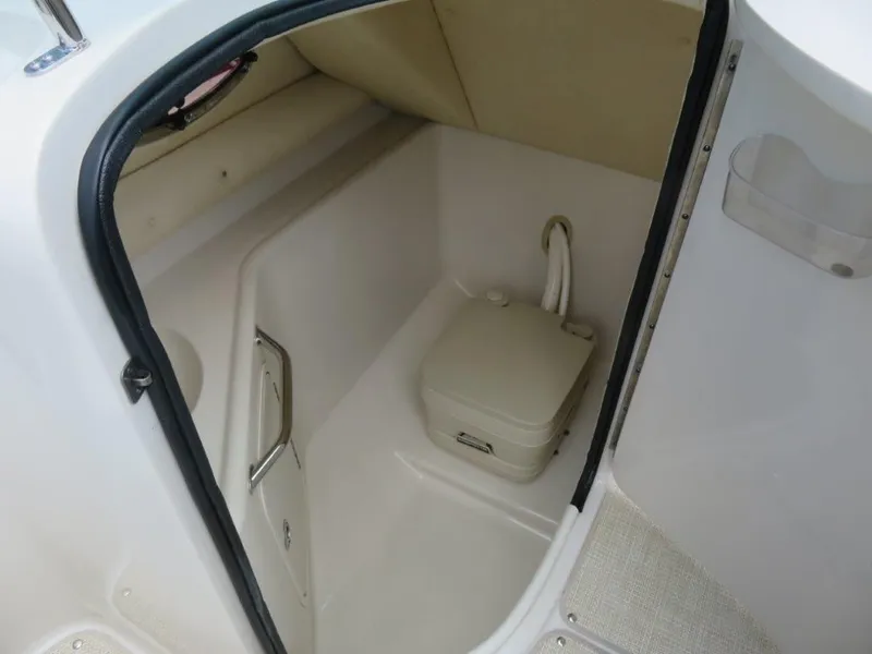 Slide: The Image of Interior of 2006 Sea Ray 240 Sundeck with toilet. - 9
