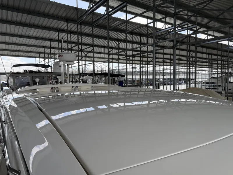 Slide: The Image of 2017 Sea Ray Sundancer 400 docked in covered marina. - 17