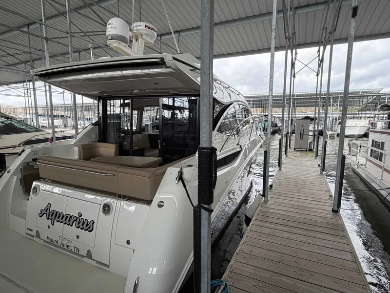 Slide: The Image of 2017 Sea Ray Sundancer 400 yacht docked, side view. - 20
