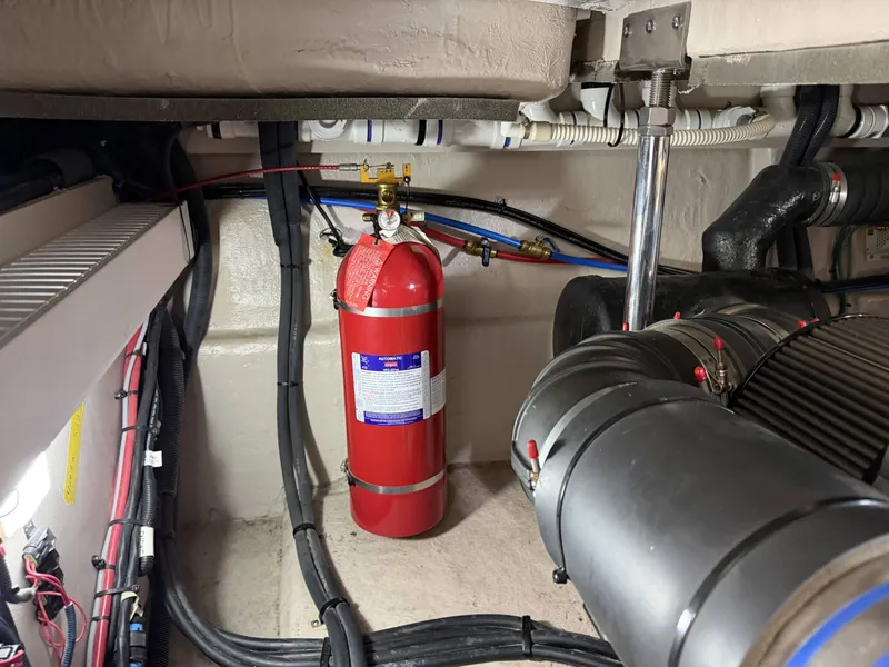 Slide: The Image of Engine room of 2017 Sea Ray Sundancer 400 with fire extinguisher. - 36