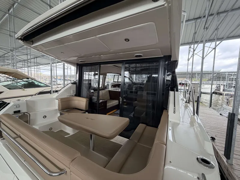 Slide: The Image of 2017 Sea Ray Sundancer 400 yacht with stylish interior and seating area. - 9