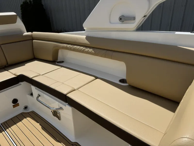 Slide: The Image of Interior of 2026 Sea Ray SDX290 with beige seating. - 12