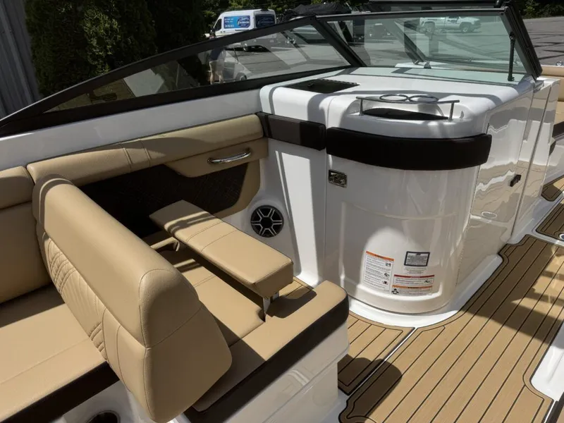 Slide: The Image of Interior of 2026 Sea Ray SDX290 with beige seating. - 14