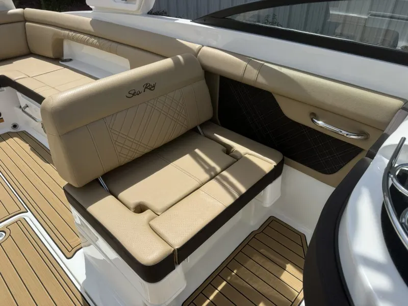 Slide: The Image of Interior of 2026 Sea Ray SDX290 with beige leather seating. - 16