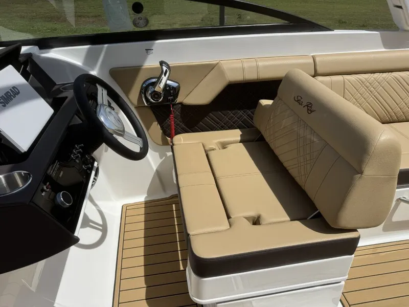 Slide: The Image of Interior of 2026 Sea Ray SDX290 with beige leather and helm console. - 17