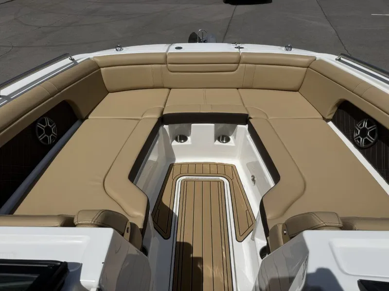 Slide: The Image of Interior of 2026 Sea Ray SDX290 with beige seating. - 23