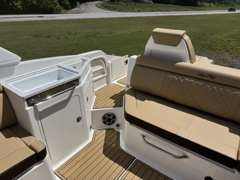 Slide: The Image of Interior of 2026 Sea Ray SDX290 with beige seating area. - 7