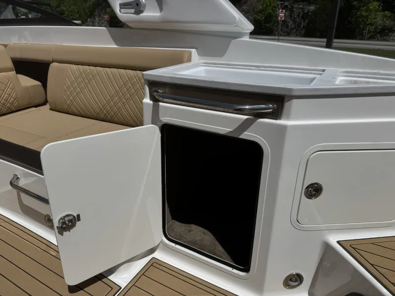 Slide: The Image of Interior of 2026 Sea Ray SDX290 with open storage compartment. - 9