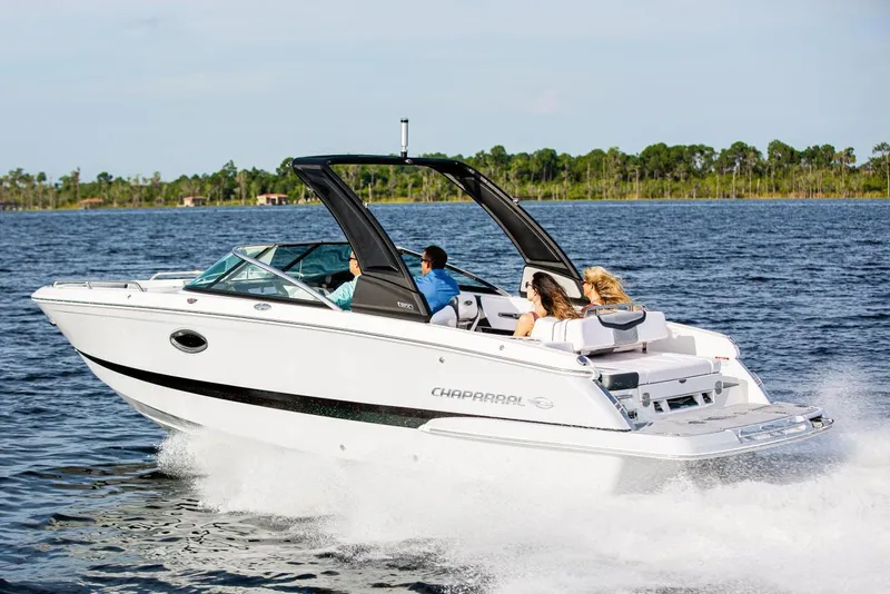 Slide: The Image of Manufacturer Provided Image: 2020 Chaparral 257 SSX boat cruising on a lake with passengers. - 1