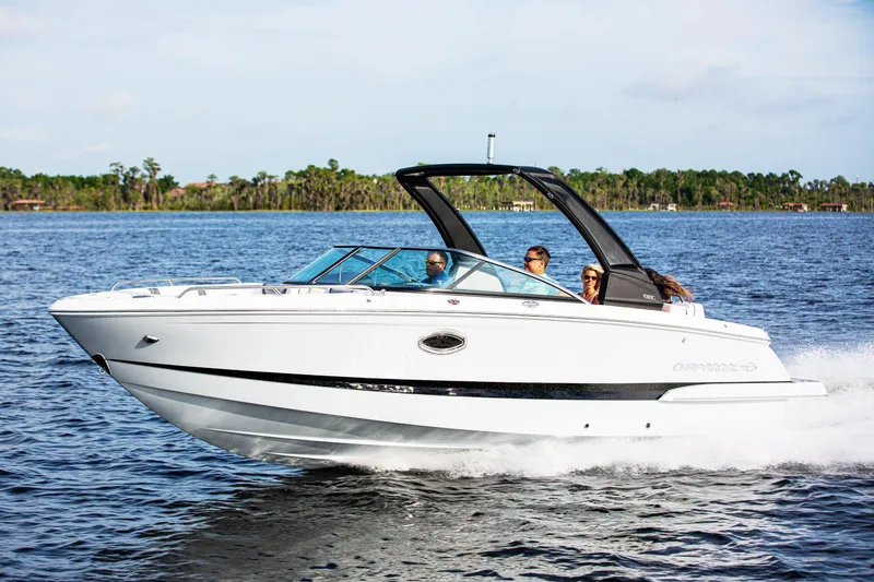 Slide: The Image of Manufacturer Provided Image: 2020 Chaparral 257 SSX boat cruising on a lake with passengers. - 2
