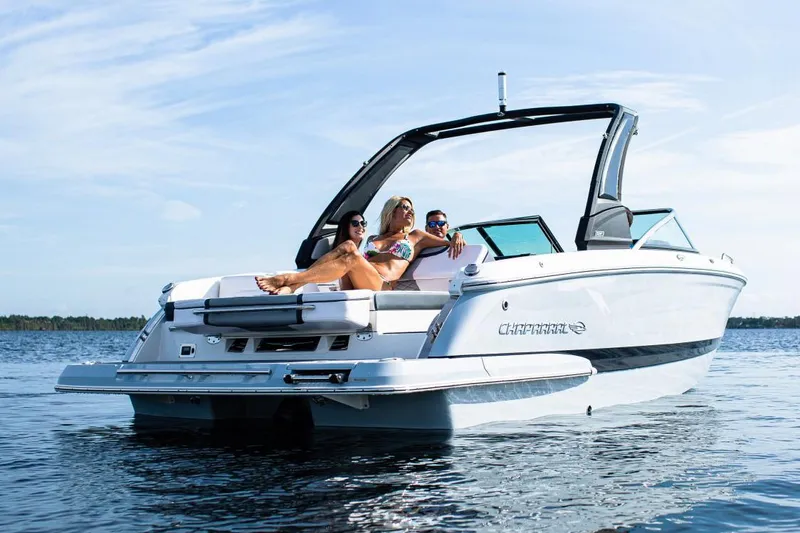 Slide: The Image of Manufacturer Provided Image: 2020 Chaparral 257 SSX boat with people relaxing on the water. - 4
