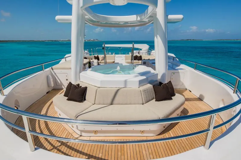 Slide: The Image of Luxurious Van Mill 143 Tri-Deck Motor Yacht with jacuzzi, 1988 model, cruising in turquoise waters. - 10