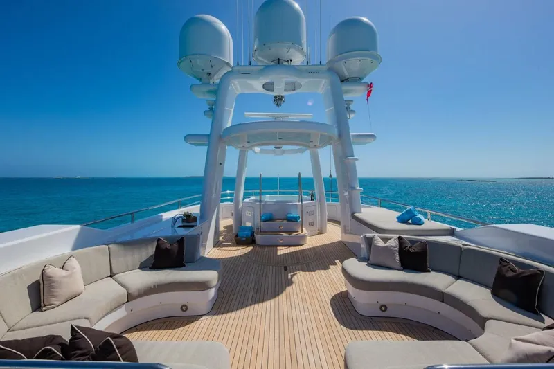 Slide: The Image of Luxurious Van Mill 143 Tri-Deck Motor Yacht, 1988, with spacious deck seating and ocean view. - 12