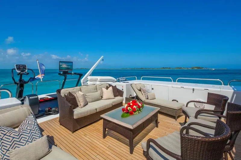 Slide: The Image of Luxurious deck of 1988 Van Mill 143 Tri-Deck Motor Yacht with elegant seating and ocean view. - 15