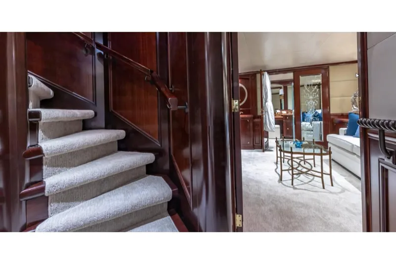 Slide: The Image of Luxurious interior of 1988 Van Mill 143 Tri-Deck Motor Yacht with elegant staircase and seating area. - 21