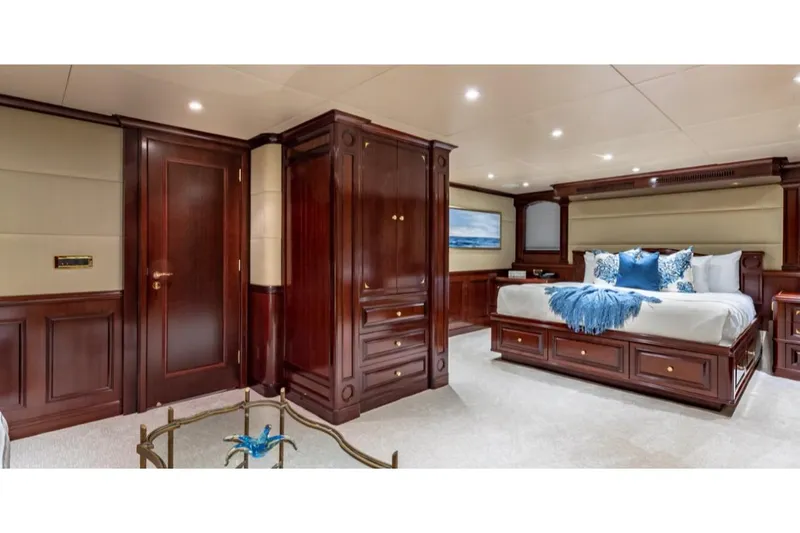 Slide: The Image of Luxurious bedroom interior on 1988 Van Mill 143 Tri-Deck Motor Yacht with elegant wood finishes. - 22