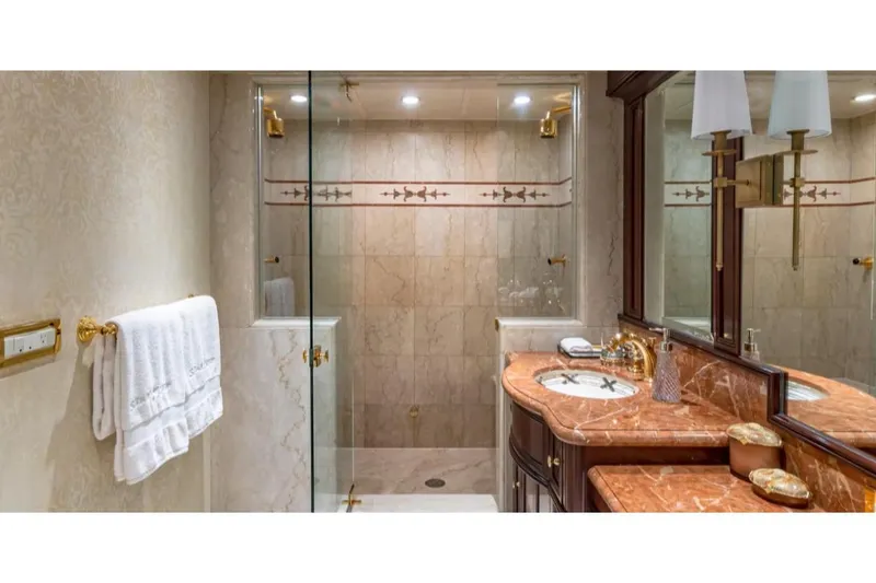 Slide: The Image of Luxurious bathroom on 1988 Van Mill 143 Tri-Deck Motor Yacht with marble countertop and glass shower. - 24