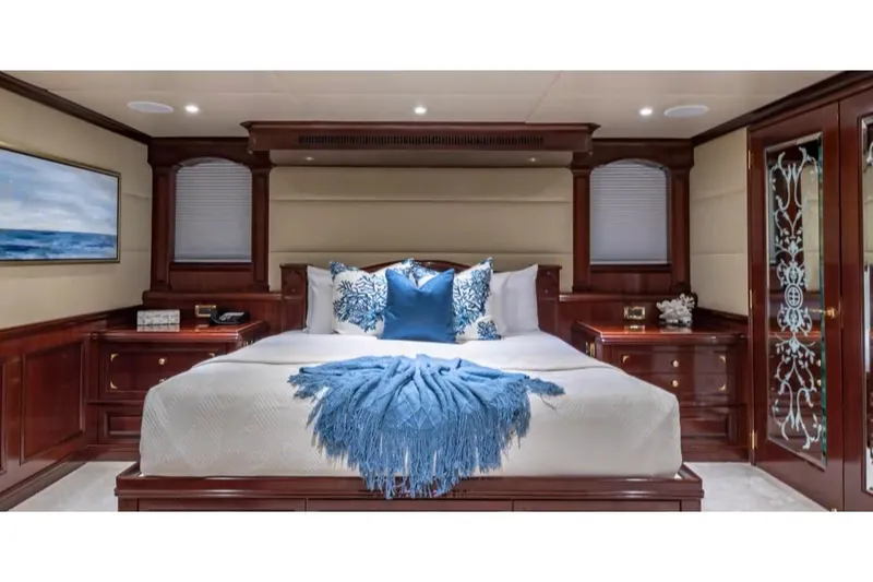 Slide: The Image of Luxurious bedroom on 1988 Van Mill 143 Tri-Deck Motor Yacht with elegant wood finishes. - 25