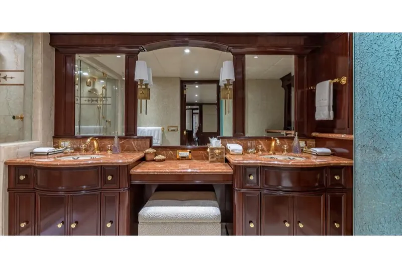 Slide: The Image of Luxurious bathroom with dual sinks and marble countertops on Van Mill 143 Tri-Deck Motor Yacht. - 29