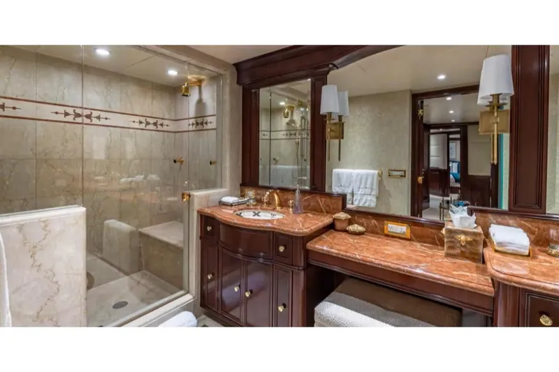 Slide: The Image of Luxurious bathroom on 1988 Van Mill 143 Tri-Deck Motor Yacht with marble countertops and elegant fixtures. - 30