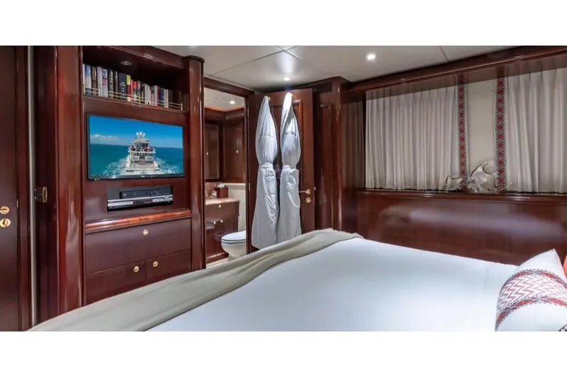 Slide: The Image of Luxurious cabin interior of 1988 Van Mill 143 Tri-Deck Motor Yacht with TV and elegant decor. - 32