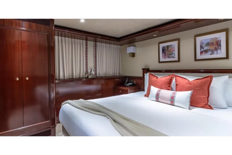 Slide: The Image of Luxurious bedroom interior on 1988 Van Mill 143 Tri-Deck Motor Yacht with elegant wood finishes. - 35