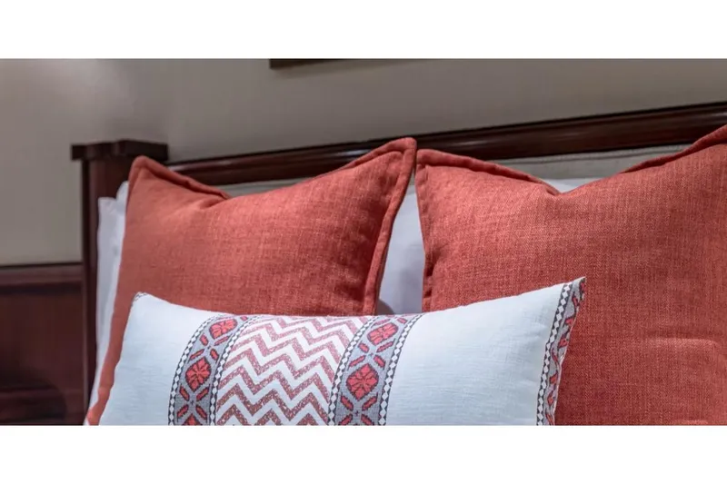 Slide: The Image of Decorative pillows on Van Mill 143 Tri-Deck Motor Yacht, 1988, featuring red and patterned designs. - 36